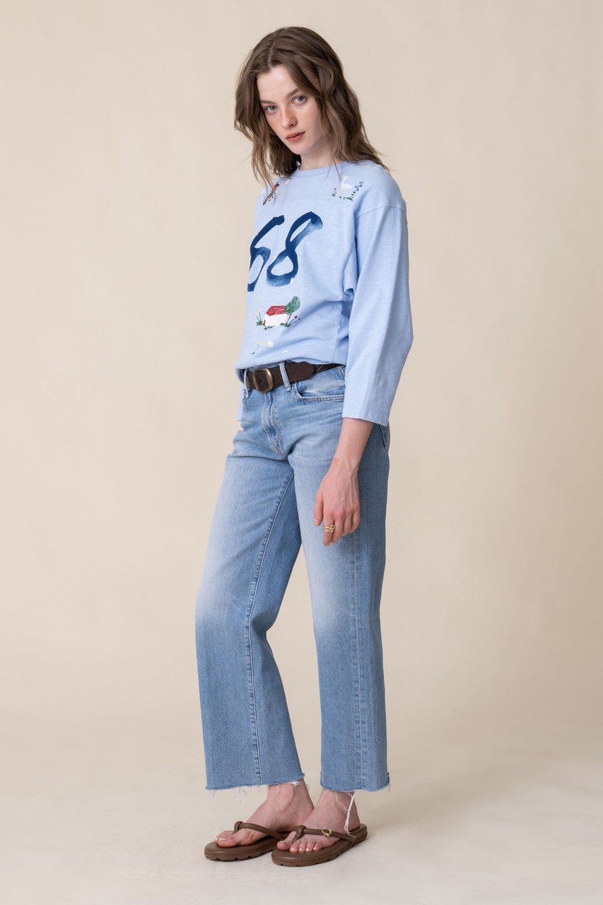 【マザー/MOTHER】のTHE FOOTBALLER 68ホリデービレッジトップス (FBA) 人気、トレンドファッション・服の通販 founy(ファニー) 　ファッション　Fashion　レディースファッション　Fashion for Women　トップス・カットソー　Cut & Sew Tops　シャツ・ブラウス・オフィスカジュアル　Elegant Blouses & Button-Ups　ロングTシャツ・Tシャツ　Longline T-Shirts & Tees　カットソー・ベーシックTシャツ　Cut-and-Sewn Tops / Stretch Tees & Basics　グラフィック　Graphic, Graphic Design　スリーブ　Sleeve, Long Sleeve / Short Sleeve　デニム　Denim, Jeans Material　フレア　Flare, Flared　ボトム　Bottoms, Lower Wear　ロング　Long, Long-Length　other-7|ID: prp329100004899520 ipo3291000000036657489