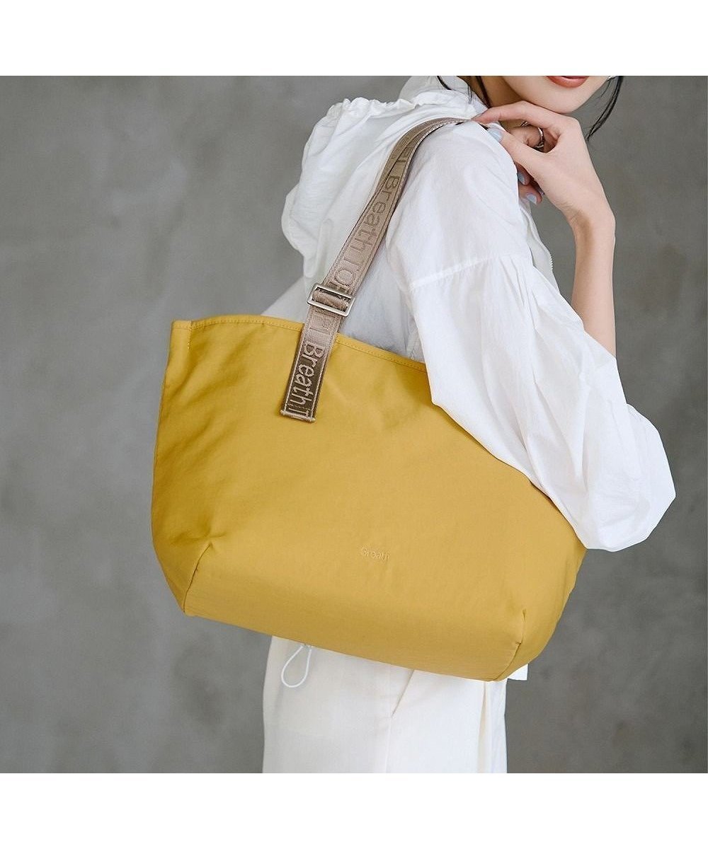 【トプカピ/TOPKAPI】の【Breath TOPKAPI】Freely フリーリー ナイロン ロゴテープ トートバッグ A4対応 インテリア・キッズ・メンズ・レディースファッション・服の通販 founy(ファニー) 　ファッション　Fashion　レディースファッション　WOMEN　バッグ　Bag　アシンメトリー　Asymmetry　フォルム　Form　ポケット　Pocket　再入荷　Restock/Back In Stock/Re Arrival　イエロー|ID: prp329100004386446 ipo3291000000031941948