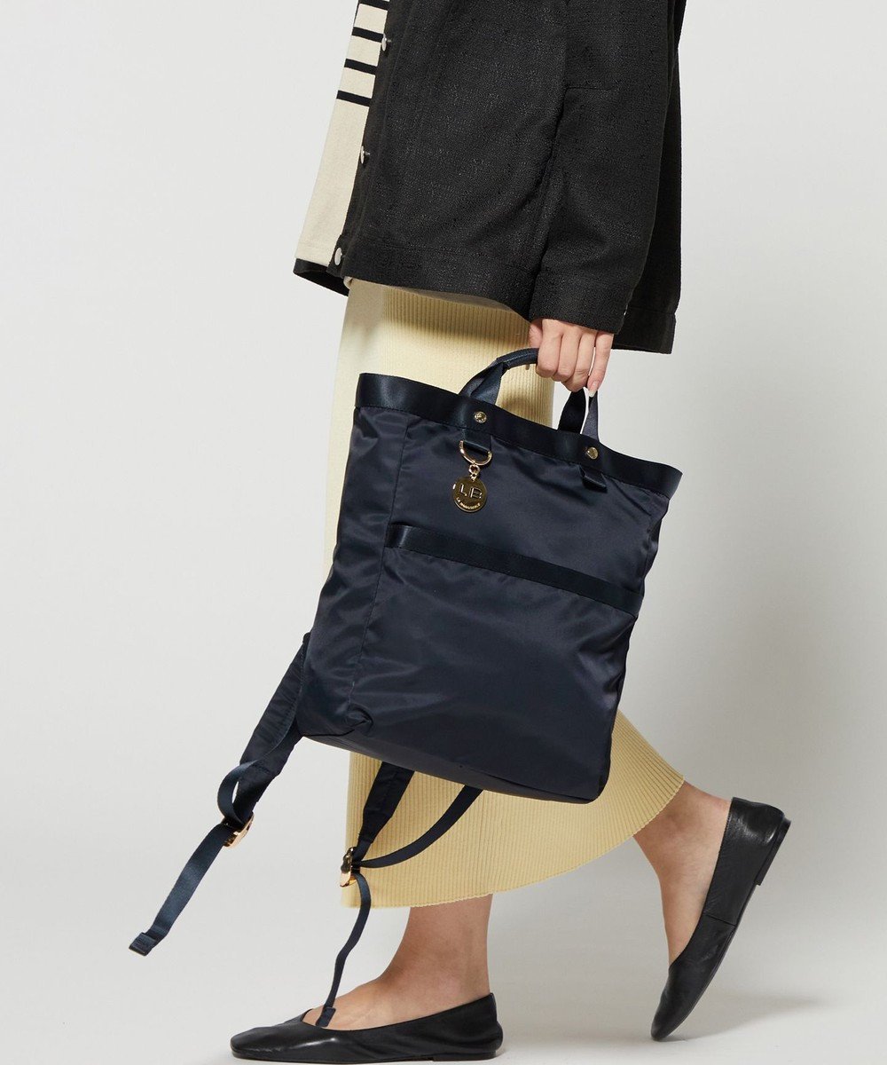 【ラ バガジェリー/LA BAGAGERIE】のチャーム付き ナイロンリュック インテリア・キッズ・メンズ・レディースファッション・服の通販 founy(ファニー) 　ファッション　Fashion　レディースファッション　Fashion for Women　バッグ　Bags　軽量　Lightweight, Ultra Light　ショルダー　Shoulder, Shoulder Strap　スクエア　Square, Square Shape　スマート　Smart, Elegant　チャーム　Charm, Pendant　定番　Standard, Basic Item　ポケット　Pocket, Pocket Detail　リュック　Backpack, Rucksack　再入荷　Restock / Back in Stock　おすすめ　Recommended / Our Picks　エレガント 上品　Elegant　ビジネス 仕事 通勤　Business / Work / Commuting　ネイビー|ID: prp329100004465746 ipo3291000000032773317