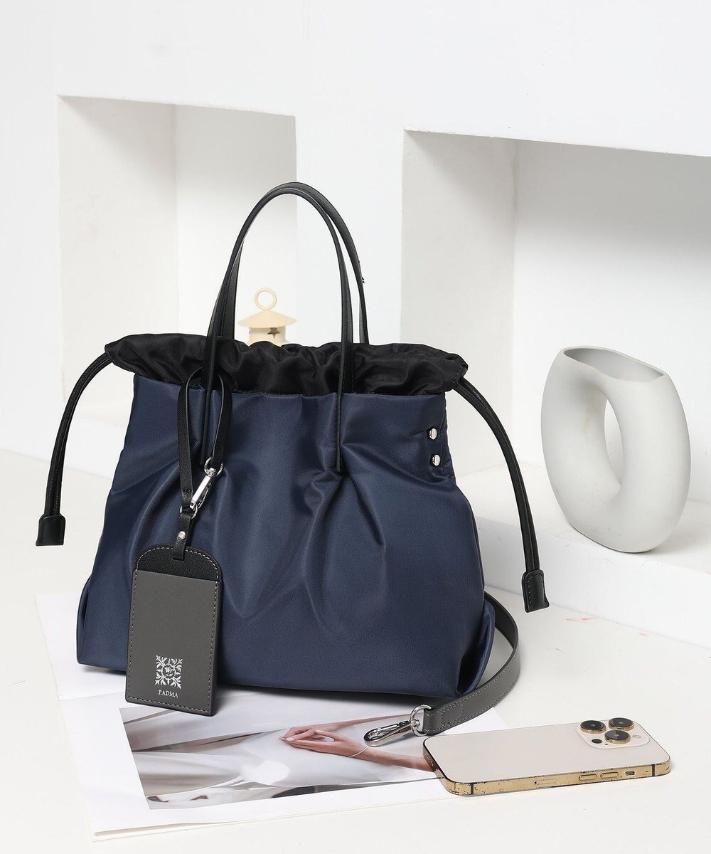 【スタイルコード/STYLE CODE】の【PADMA/パドマ】ナイロン×レザー 巾着 ショルダーバッグ 2WAY インテリア・キッズ・メンズ・レディースファッション・服の通販 founy(ファニー) 　ファッション　Fashion　レディースファッション　Fashion for Women　巾着　Drawstring Bag, Kinchaku　軽量　Lightweight, Ultra Light　スタイリッシュ　Stylish, Fashionable　フォルム　Silhouette, Form　旅行　Travel　エレガント 上品　Elegant　ネイビー|ID: prp329100004624962 ipo3291000000033221948